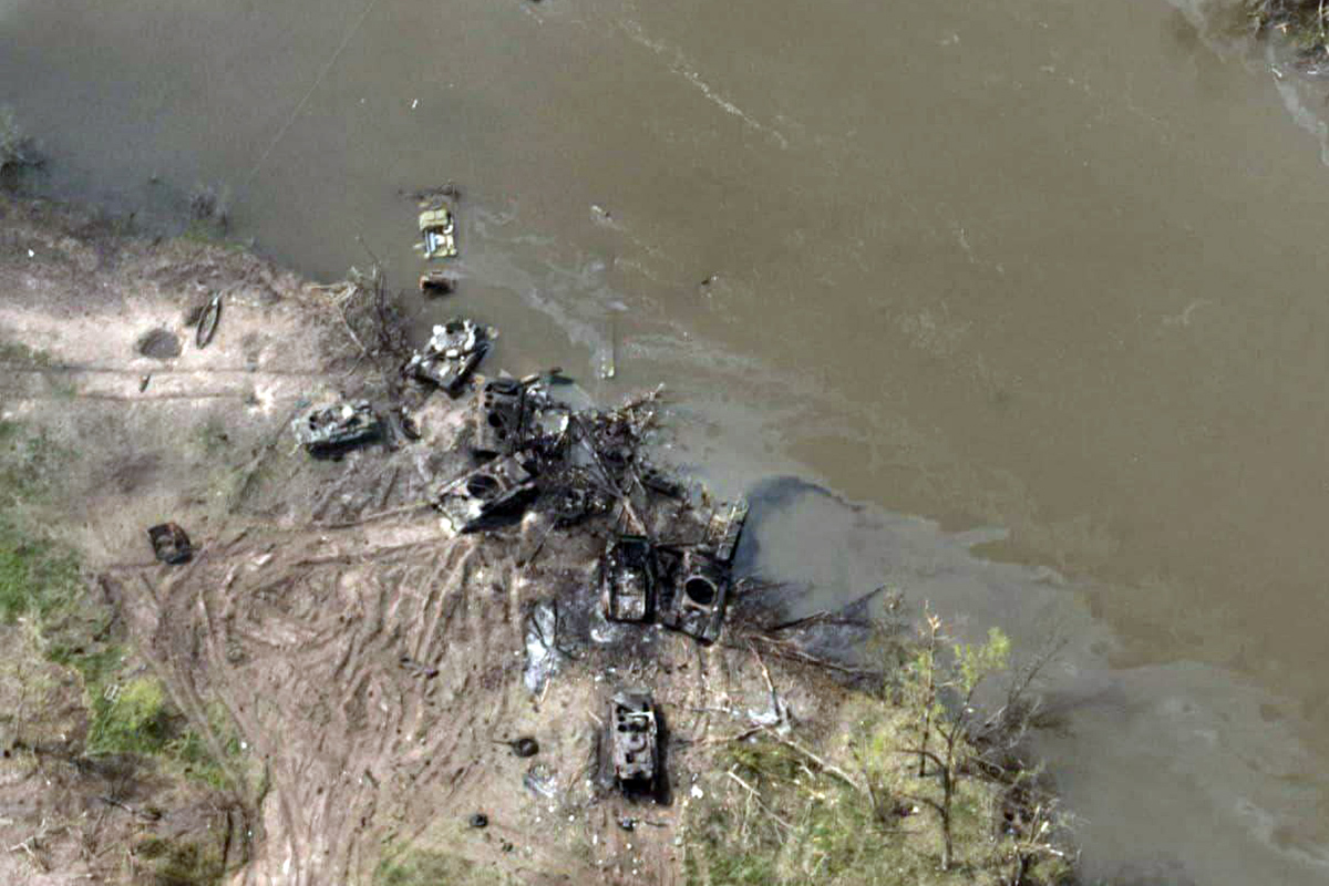 Image released by Ukraine Armed Forces on Thursday May 12, 2022 shows Russian tanks destroyed along a dirt track by the Siverskyi Donets River after their pontoon bridges blown up in eastern Ukraine, saying that the armyТs 80th Separate Assault Brigade had destroyed all attempts by the Russian occupiers to cross the river. Images shared by the defense ministry appeared to show a ruined pontoon crossing with dozens of destroyed or damaged armored vehicles on both banks. The Siverskyi Donets, which flows from southern Russia through the separatist Ukrainian regions of Kharkiv and Luhansk, has become a key barrier against Russia's attempts to shore up the territory it has seized since invading in February.
