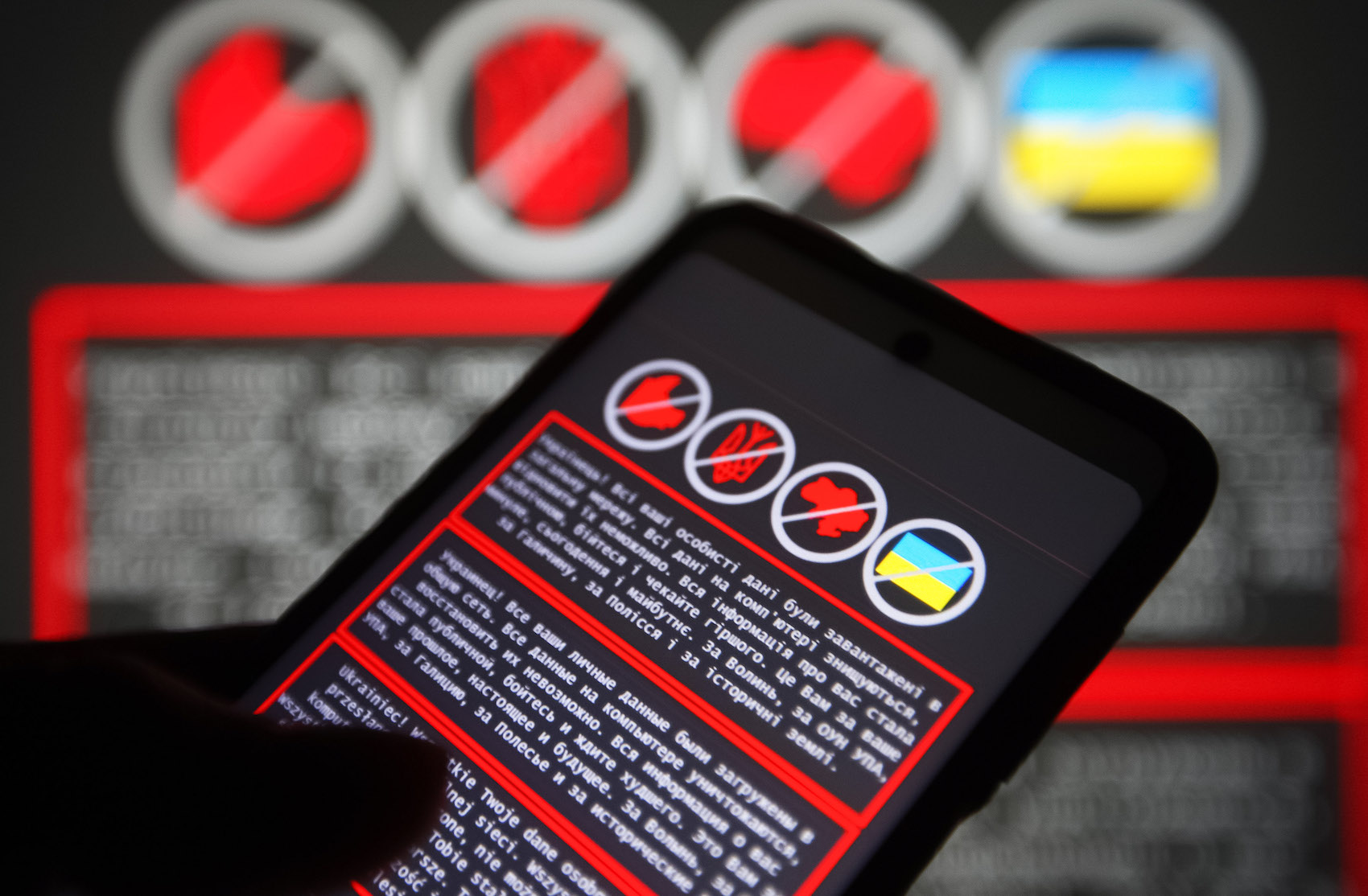 UKRAINE - 2022/01/14: In this photo illustration, a warning message in Ukrainian, Russian and Polish languages is displayed on a smartphone screen and in the background.
Hackers carried out attacks on several Ukraine's government websites, including the Ministry of Foreign Affairs, the Ministry of Education and Science, the State Service for Emergency Situation and others, reportedly by local media. This attack, on Ukrainian government web resources is the largest in the last four years. (Photo Illustration by Pavlo Gonchar/SOPA Images/LightRocket via Getty Images)
