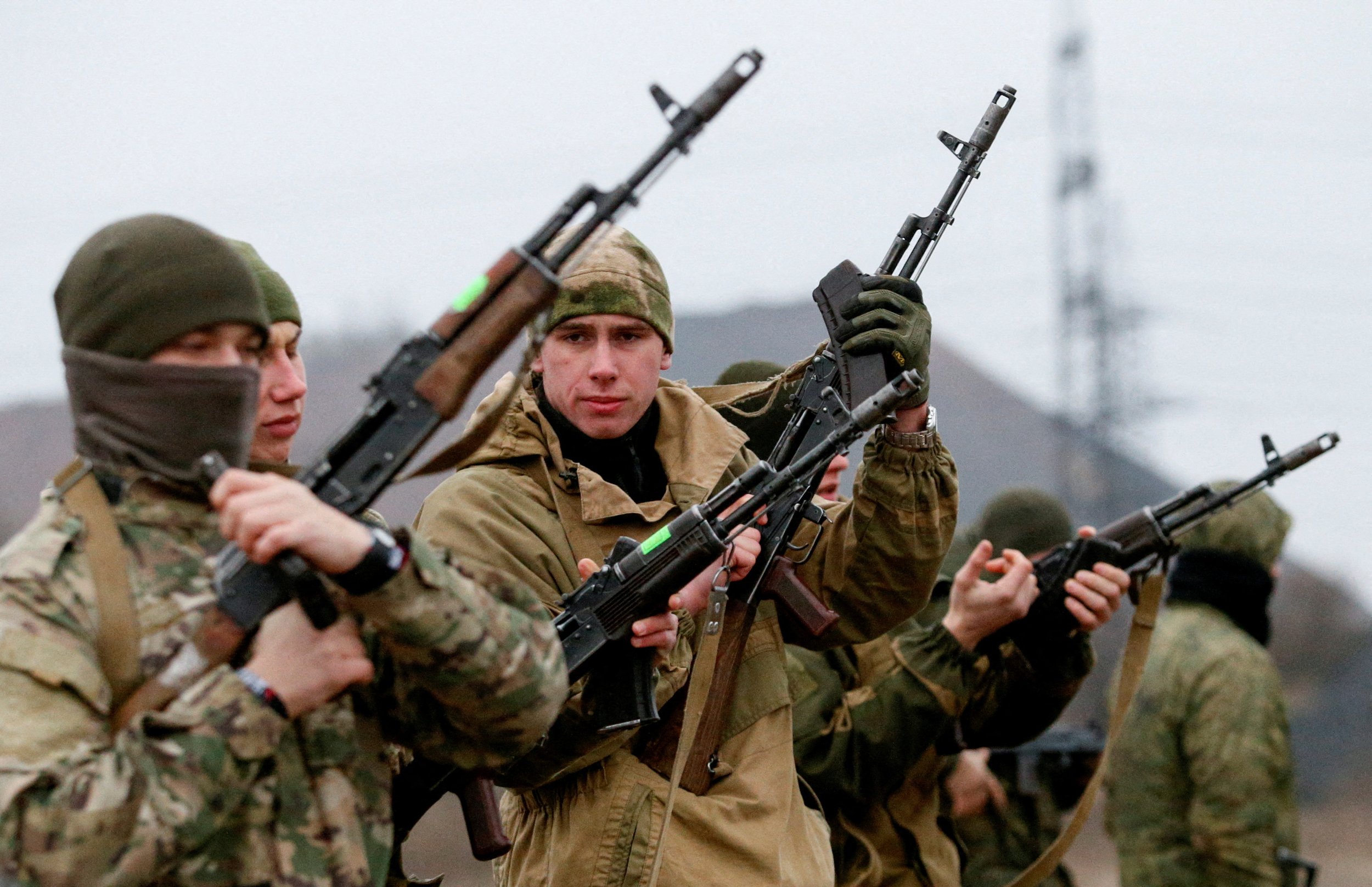FILE PHOTO: Militants of the self-proclaimed Donetsk People's Republic take part in shooting drills at a range on the outskirts of Donetsk, Ukraine, December 14, 2021. REUTERS/Alexander Ermochenko/File Photo
