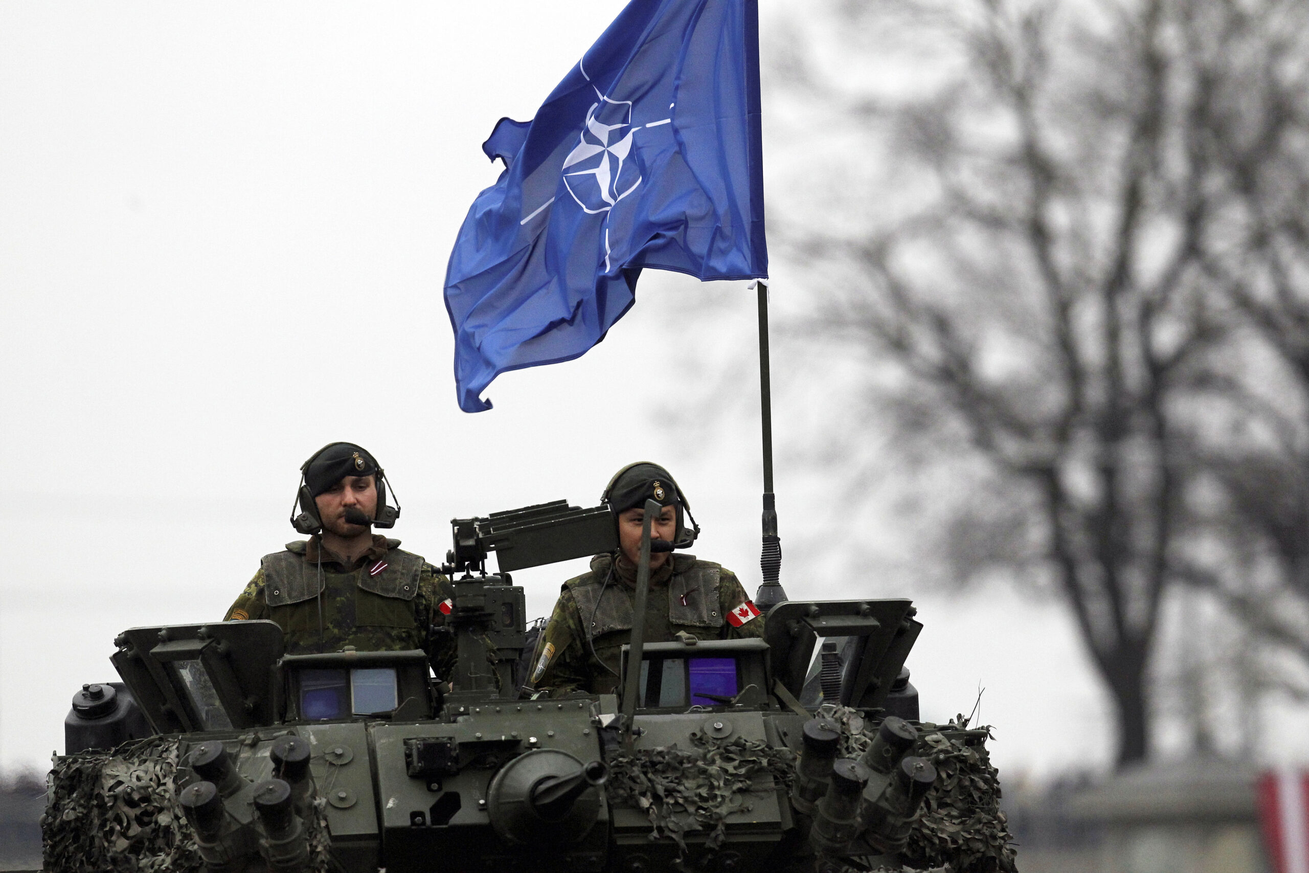 epa08006292 Canadian soldiers, members of the NATO Enhanced Forward Presence battle group, take part in a military parade during the celebrations of the 101st anniversary of Latvian Independence in Riga, Latvia, 18 November 2019. Latvia celebrates its 101st anniversary of declaration of independence by the People's Council of Latvia on 18 November 1918.  EPA-EFE/TOMS KALNINS