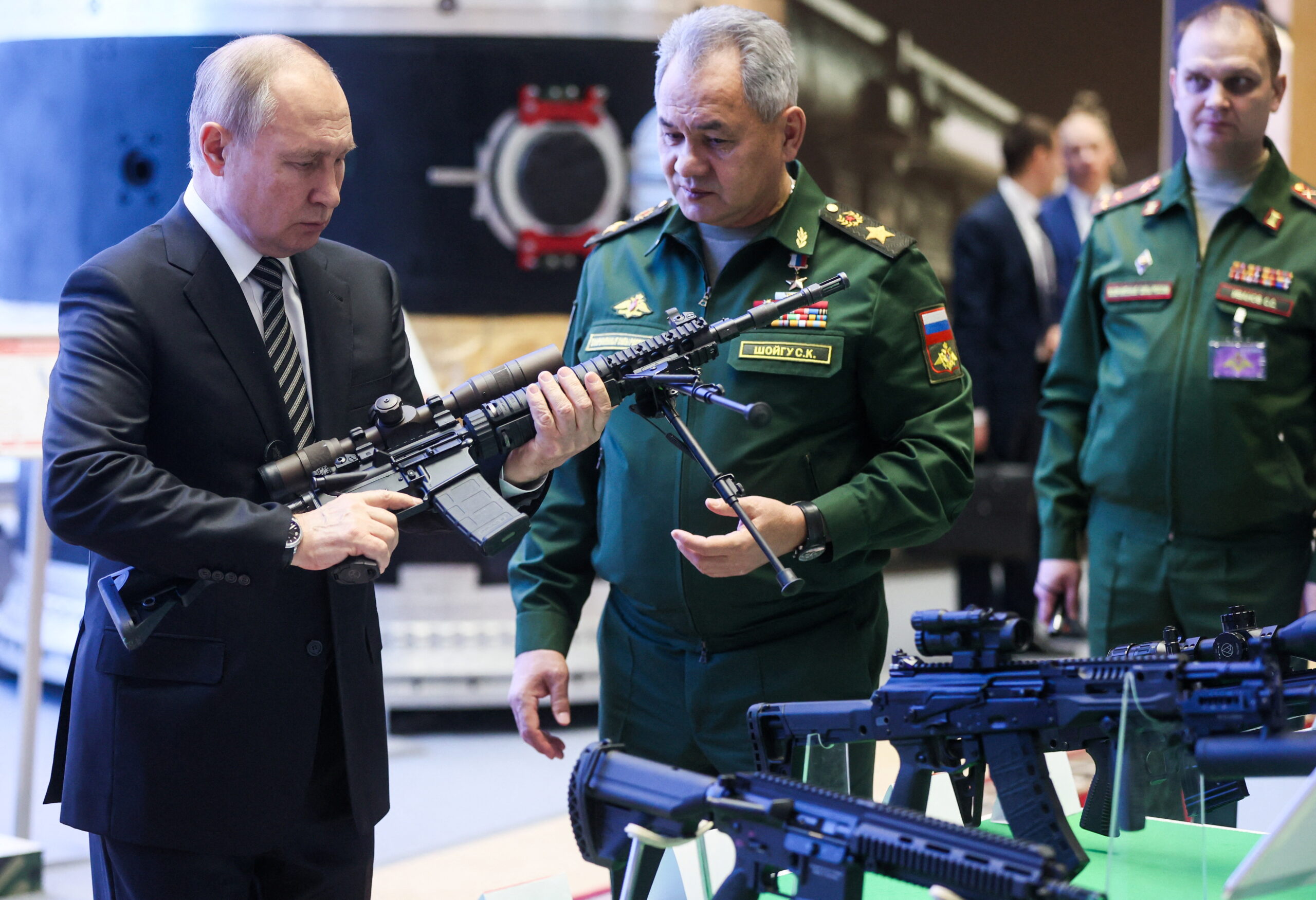 Russian President Vladimir Putin and Defence Minister Sergei Shoigu attend a military exhibition before an expanded meeting of the Defence Ministry Board in Moscow, Russia December 21, 2021. Sputnik/Mikhail Metzel/Pool via REUTERS ATTENTION EDITORS - THIS IMAGE WAS PROVIDED BY A THIRD PARTY.