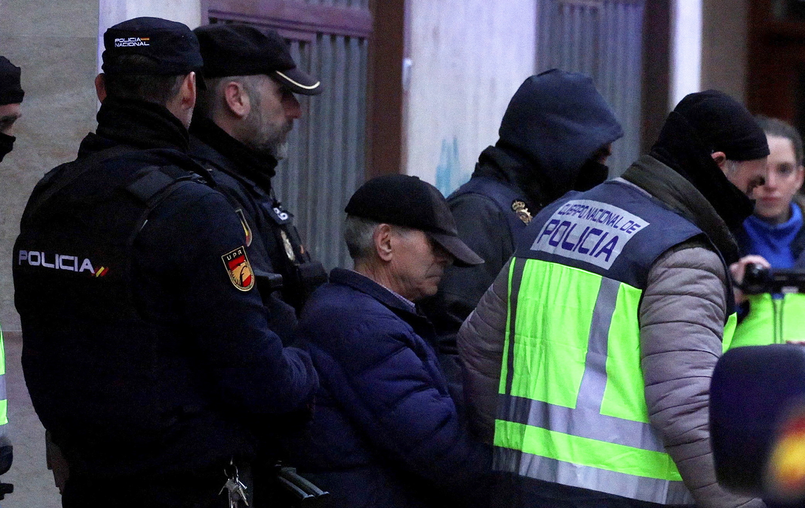 Spanish national police officers lead away a 74-year-old man under arrest on suspicion of being the sender of letter-bombs in November and December to the Ukrainian and U.S. embassies and several institutions in Spain, in Miranda de Ebro, Spain January 25, 2023. REUTERS/Vincent West